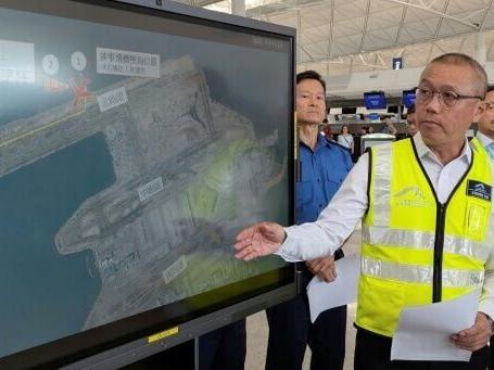 Cargo plane skids off Hong Kong runway, kills 2